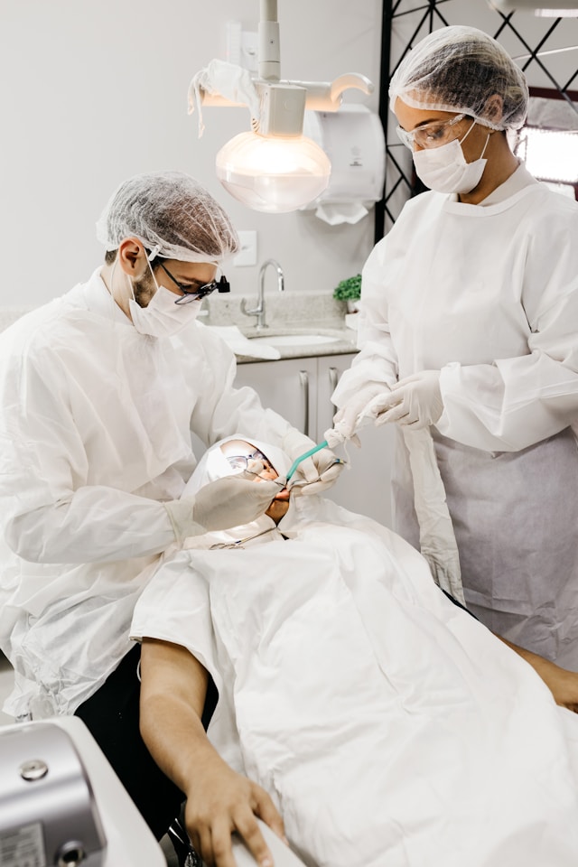 Friendly dentist with patient